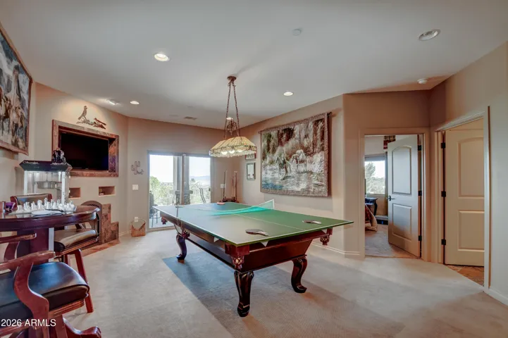 This expansive floor features a pool table, ping pong, cozy fireplace, provides endless fun for friends and family gatherings