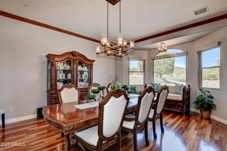 American Cherry Wood Floors, Cherry Wood Crown Molding and architectural windows define the elegance of this room