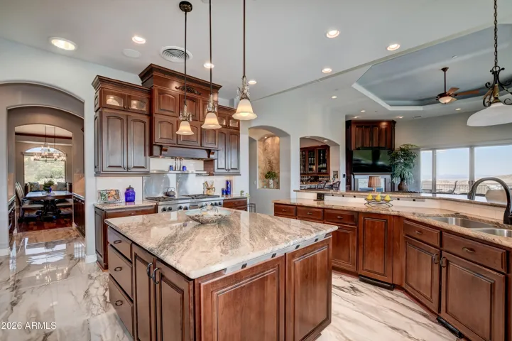 Center island provides versatile space for meal preparation with an added touch of electrical strips on each side