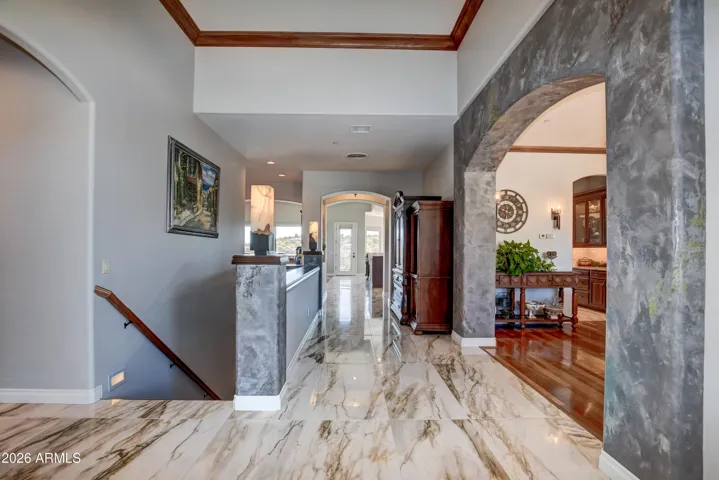 Highlighted with sophisticated and luxury appointments with custom made onyx lighting that showcases the entry and stairway