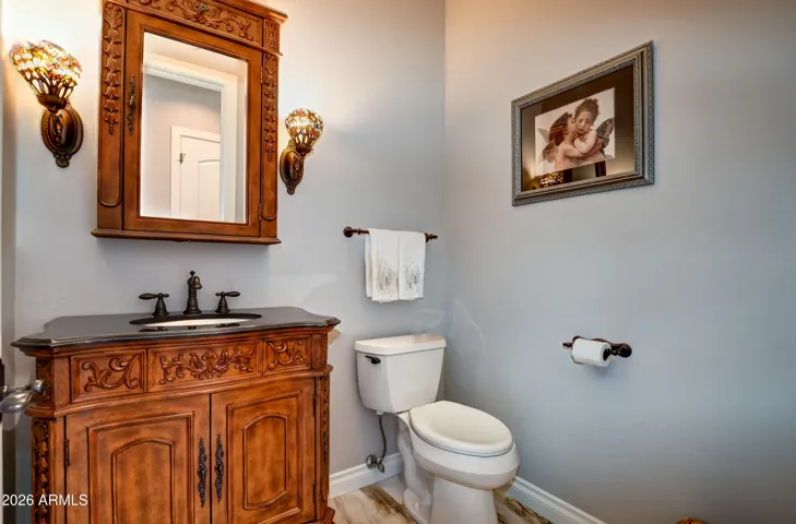 Main floor guest bath with custom vanity and custom medicine cabinet with granite countertop