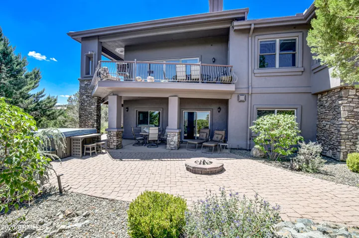 Outdoor covered and open living area complete with hot tub to indulge into relaxation and outdoor enjoyment