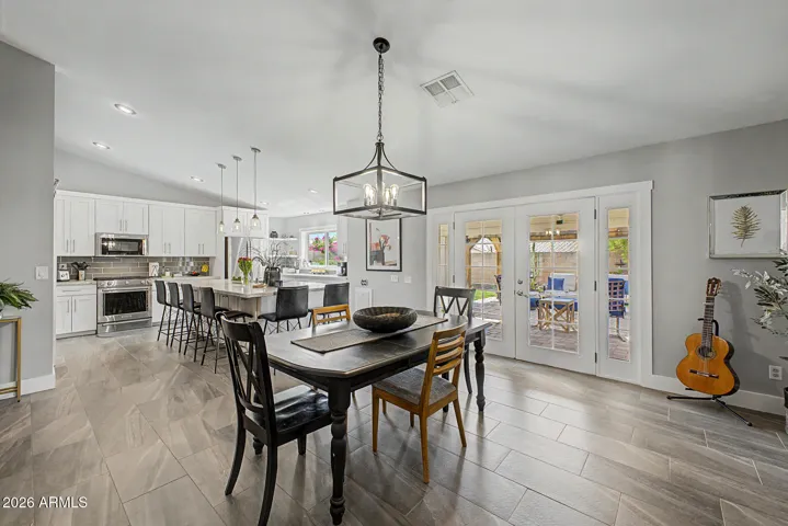 Dining area opens to kitchen with 9 foot island