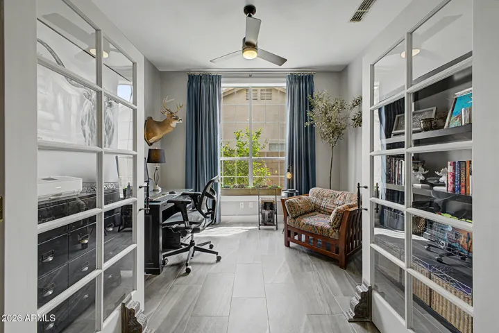 Bright workspace with large window overlooking lemon, lime, and grapefruit trees.
