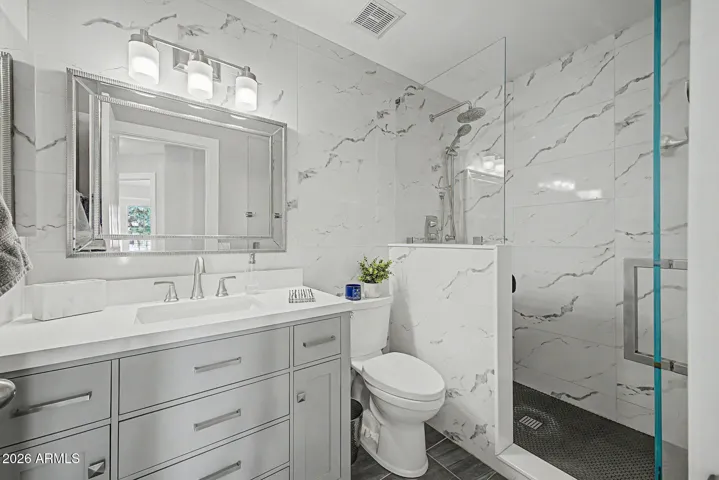 Updated hall bath with modern vanity, upgraded fixtures, and clean, contemporary design