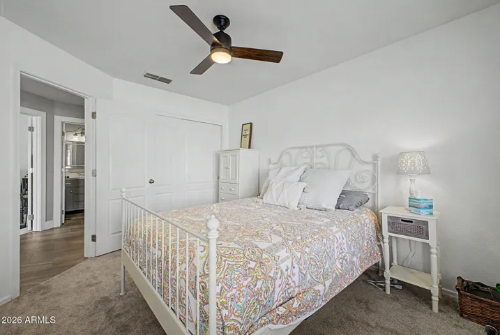 Well-sized secondary bedroom in split floor plan with ample natural light and easy access to nearby bath.