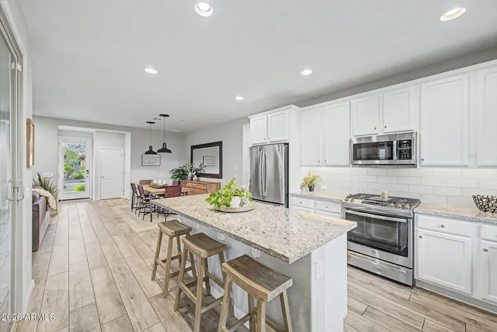 Oversized island is ideal for casual dining, serving and food preparation!