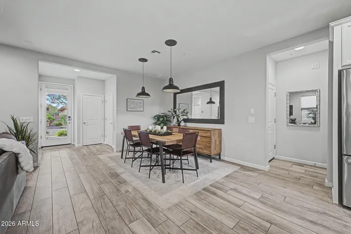 Gorgeous wood look plank tile flooring. Dining area is off great room