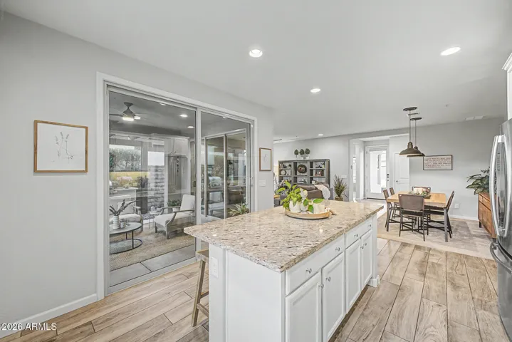 8 foot sliding door leads to rear patio and floods the space with natural light