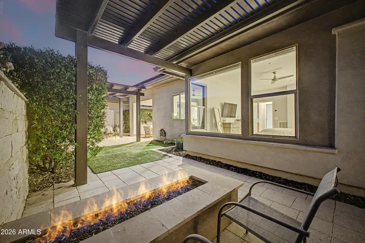 Gorgeous firepit outside primary suite.