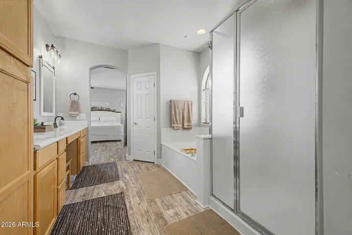 Primary bath offers dual vanities, bathtub and shower for your spa like routine.