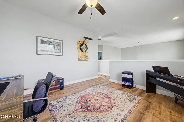 Upstairs landing provides a secondary flex space. Perfect for a home office, gym or play nook.