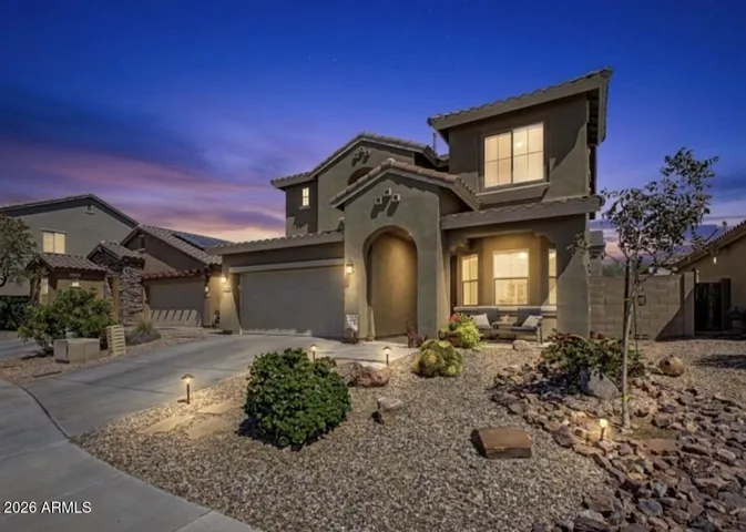Curb appeal at its finest with low maintenance desert landscaping.