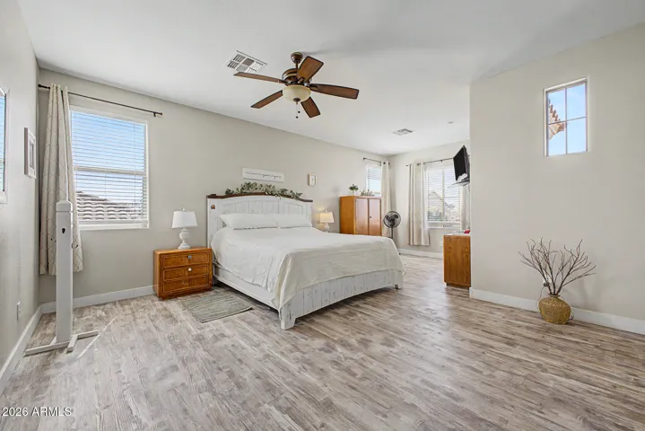 Retreat to the Primary bedroom with natural light and plenty of room for a king sized set.