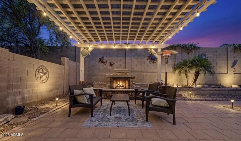 Cozy up by the stone fire pit, a centerpiece designed for Arizona nights.