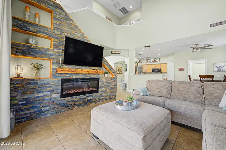 Relax in the spacious great room with a custom built stone fireplace.