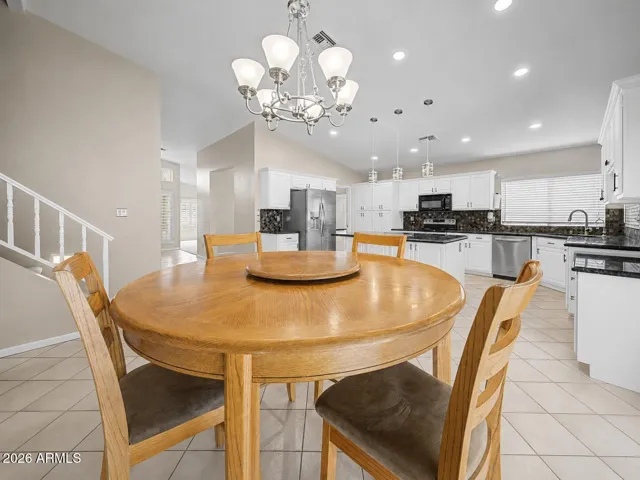 Dining kitchen area next to the kitchen with expansive counter space and a large center island—perfect for cooking, serving, and gathering.