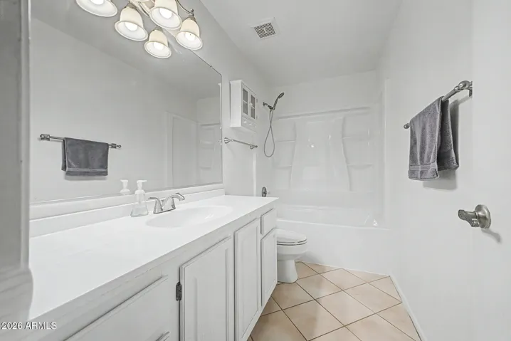 Upstairs secondary bathroom with full layout, including vanity and shower/tub combination for shared use.