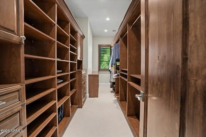 Two large custom closets in the primary bedroom.