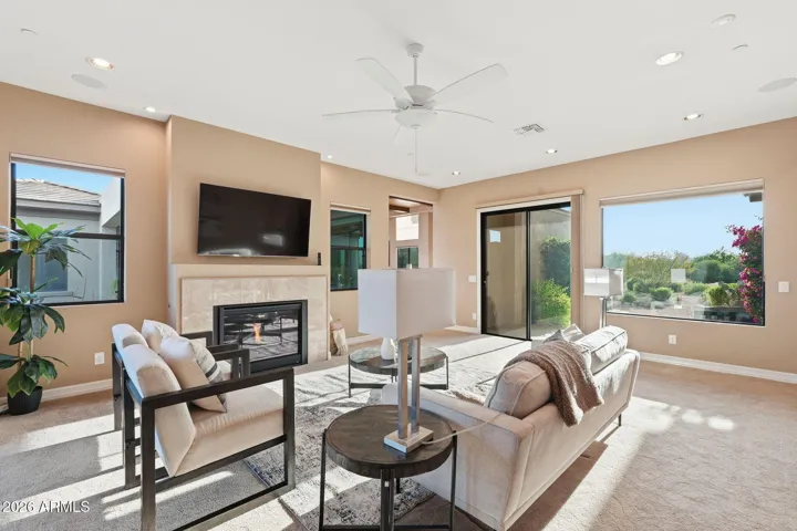 Gas fireplace and sliders to front and back exteriors.