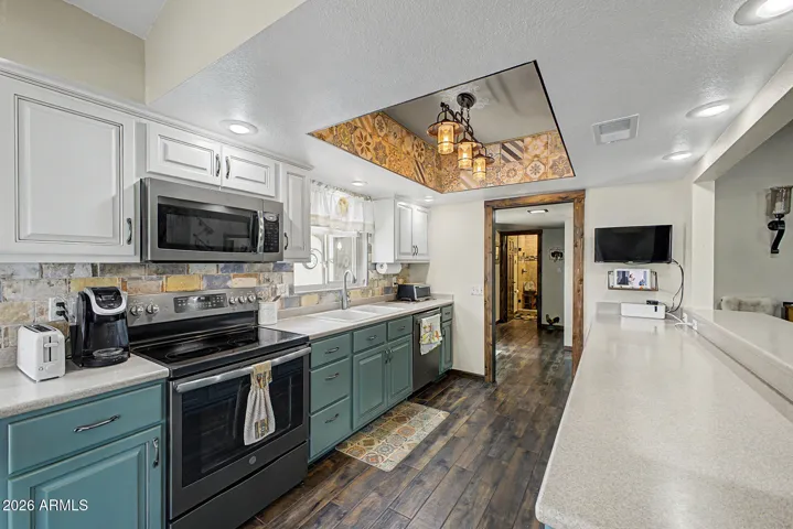 IIsle kitchen with ceramic tile floors that look like wood