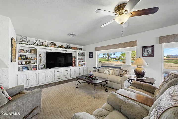 Family room with windows overlooking golf course