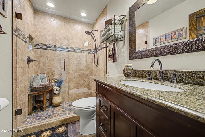 Hall bath with walkin tile shower granite counter