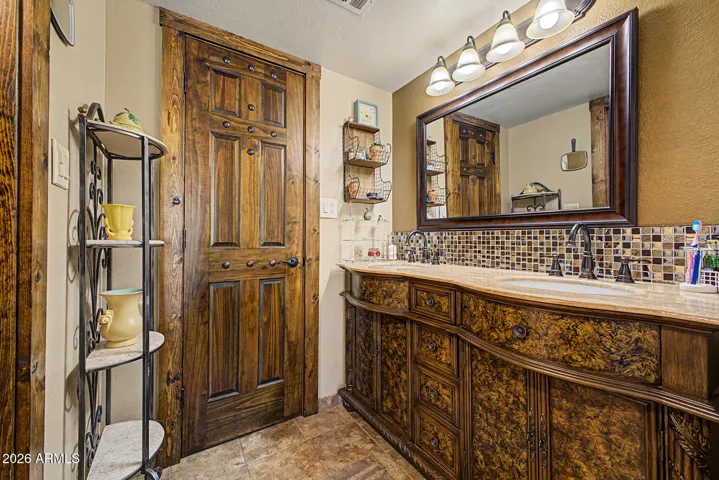 Primary bath with double sinks in a furniture vanity