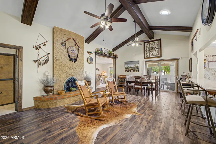 Beamed great room with wood burning fireplace