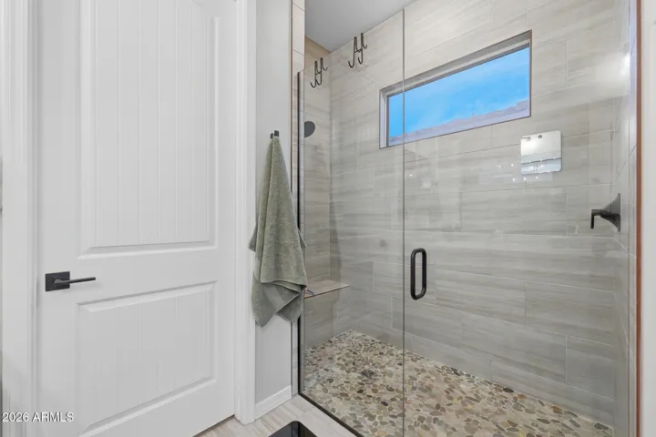 Note upgrade tile to ceiling & shower bench