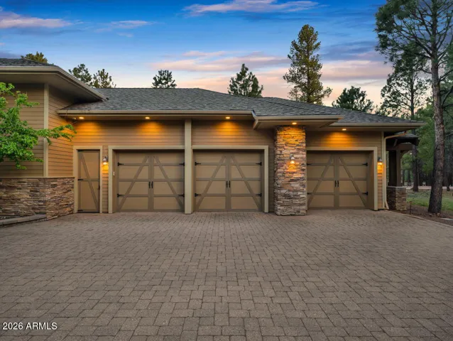 Premium 5-car garage with temperature-controlled storage, golf cart space, EV charging capability, and custom finishes designed for convenience and functionality.