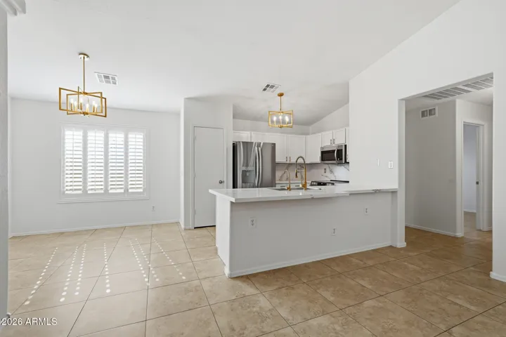 Kitchen and dining open to living room