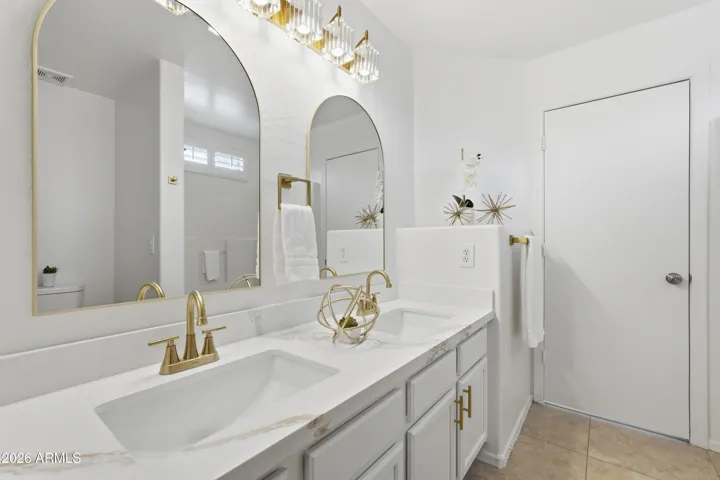 Updated with gold hardware, faucets, lighting and mirrors