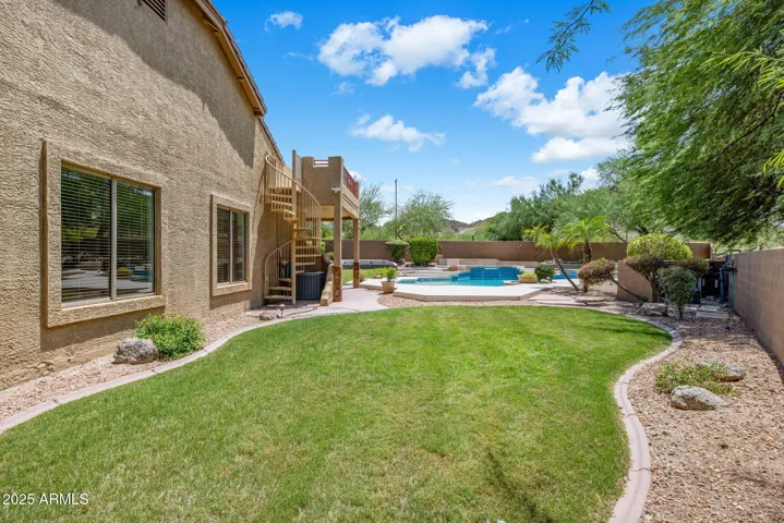 Large side lot and spiral staircase to rooftop patio