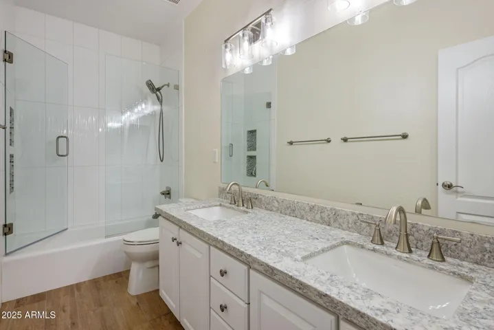 1st hall bath with tub/shower and dual vanity