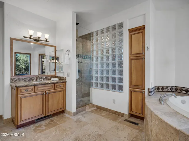 Soaking Tub, Large Walk in Shower, Two Vanities, and Separate Make Up Area
