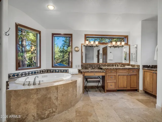 Soaking Tub, Large Walk in Shower, Two Vanities, and Separate Make Up Area