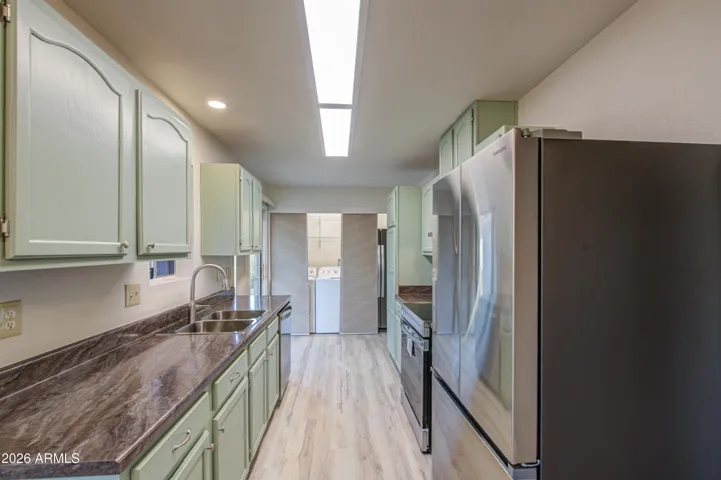 Looking toward closet with Washer Dryer and 2nd Fridge