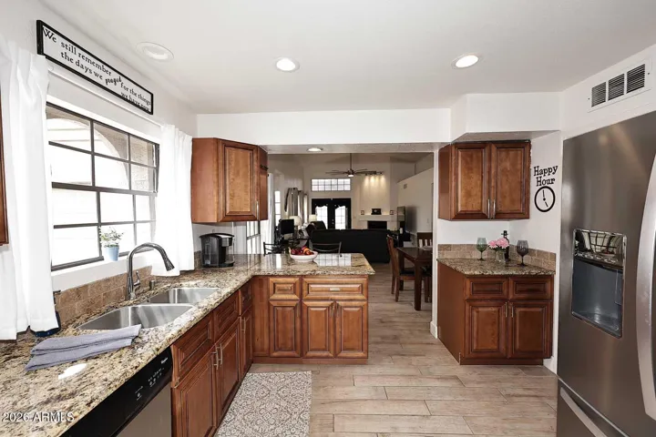 Granite countertops, stainless appliances and beautiful wood cabinetry