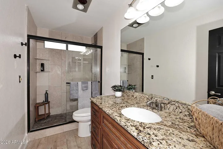 Lovely primary bath with granite countertop