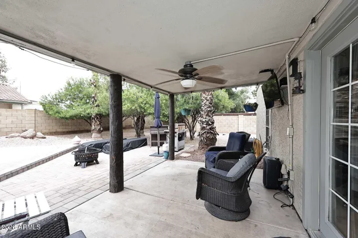 View of the back corner tree lined property