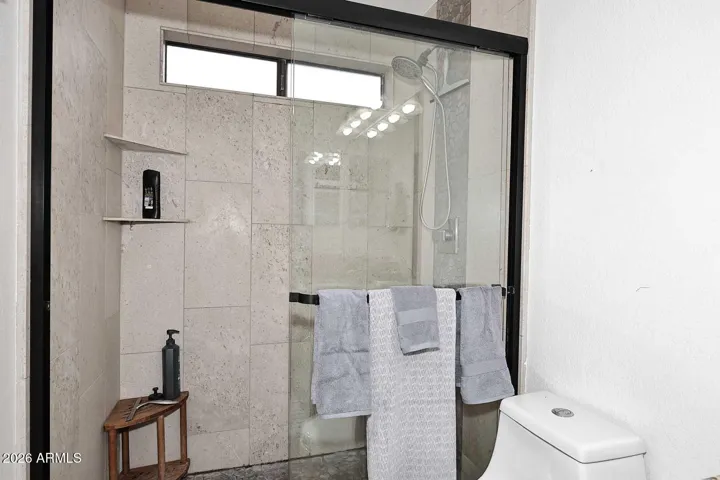 Limestone shower in the primary bathroom