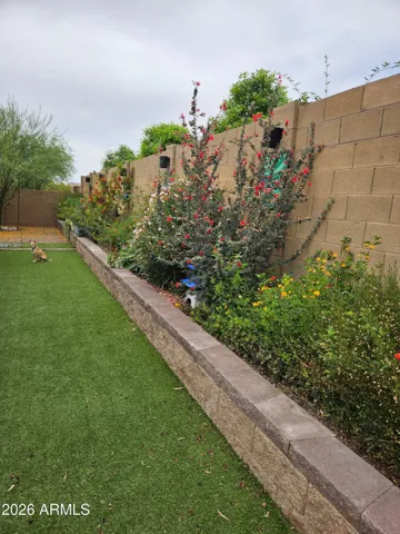 Fully landscaped backyard with artificial turf
