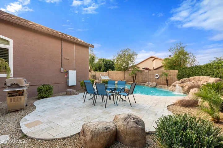 Lovely travertine pool surround and dining area.