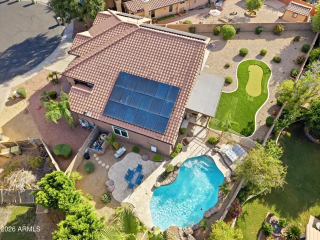 Lovely view of large lot, home and pool.