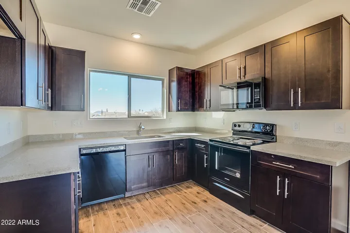 Photo from previous construction. Same floor plan. Cabinets will be white.