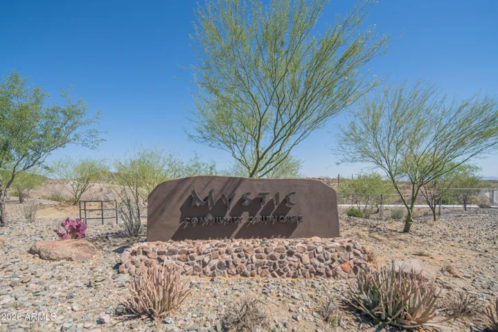 Distinctive community monument sign with stone design and engraved neighborhood name. Welcoming feature that highlights the identity and pride of this Peoria community.
