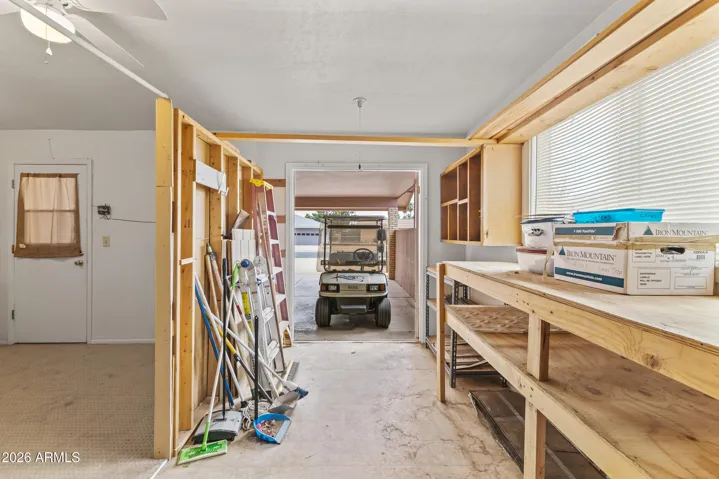 View showing golf cart parking, shop, storage area, with view to Laundry area as well