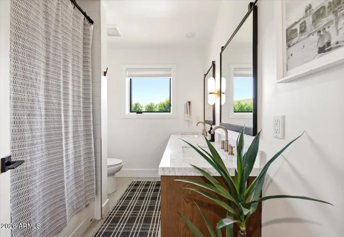 Bathroom II with tub shower and dual sink vanity