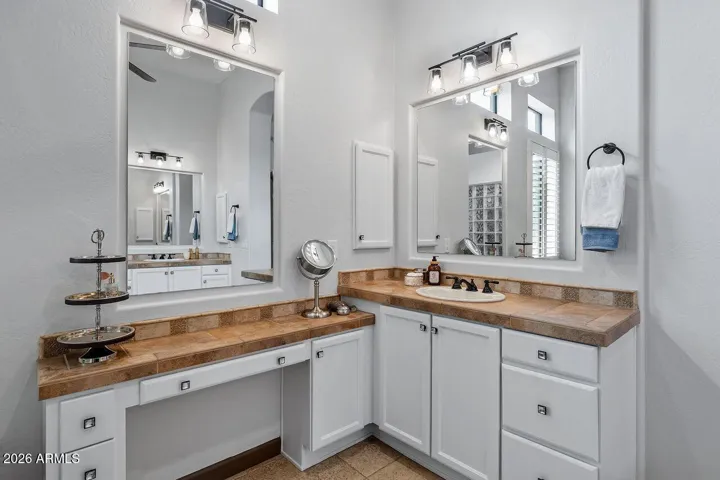 Extra large Master Suite bathroom with double vanities andup-graded lighting fixtures.